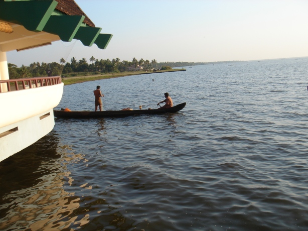 Fishermen busy catching fish in the Vembanad Lake