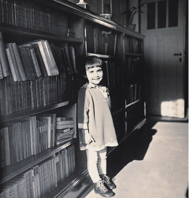 Margot in front of her parent's bookcase, March 1929